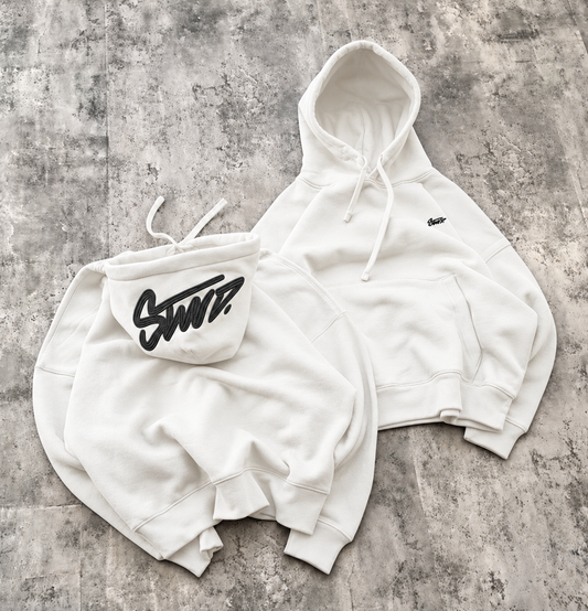 Off white fleece hoodie with black embroidery on concrete background